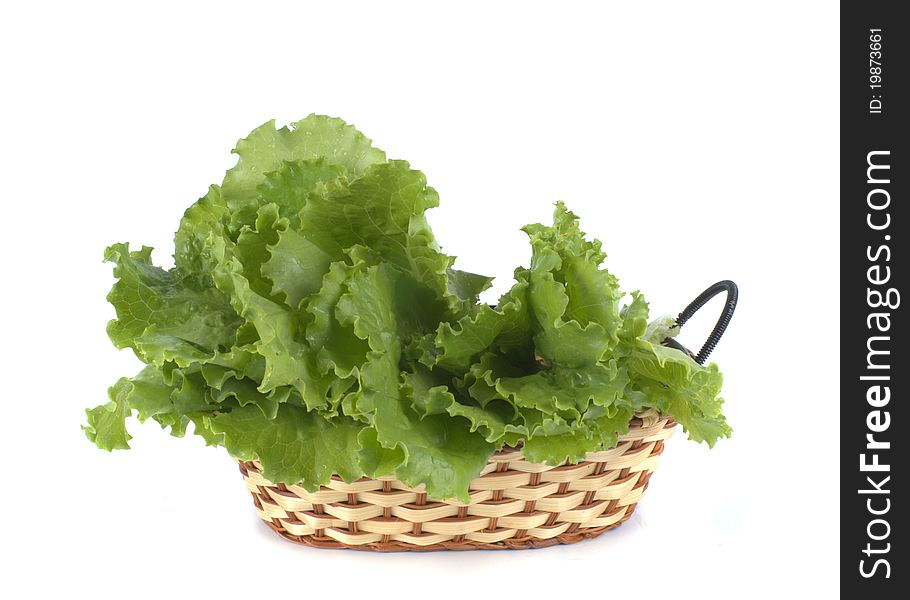 Vegetables in basket on white background