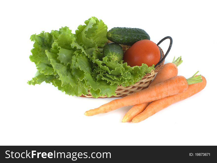 Vegetables in basket on white background