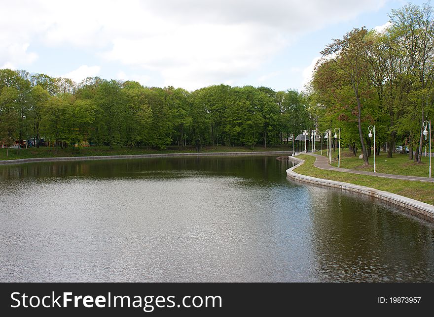 Cityscape with embankment near river in the park