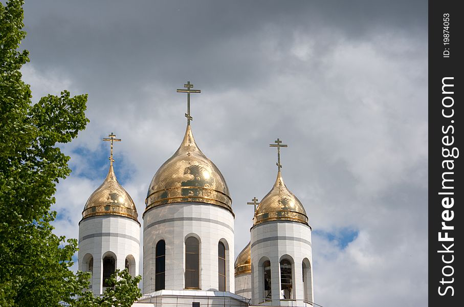 Roof of church with cloudy sky