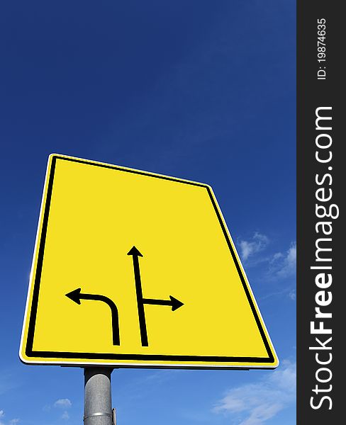 Textur-road sign under blue sky.