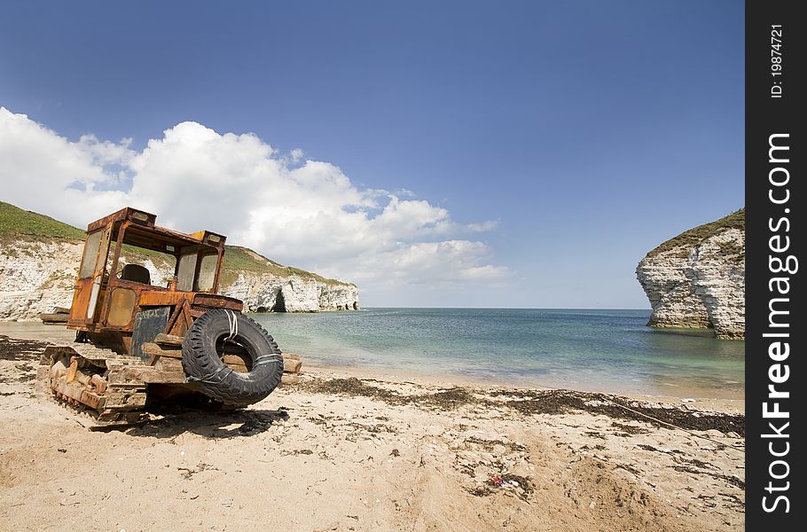 Flamborough head North landing with a old tractor used to tow boats