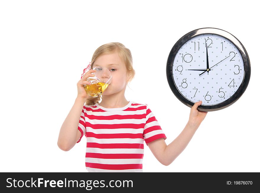 Girl with clock drinking juice from glass