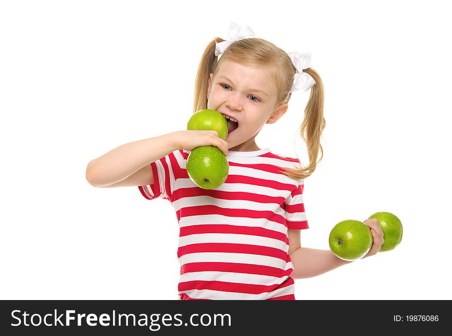 Girl bites dumbbell from apples isolated on white