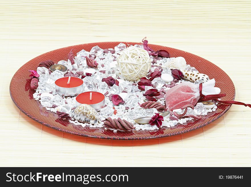 Table decoration with various shells and candles in decorative plate