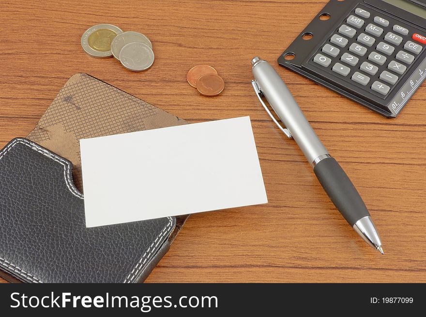 Blank name card with card holder on office table