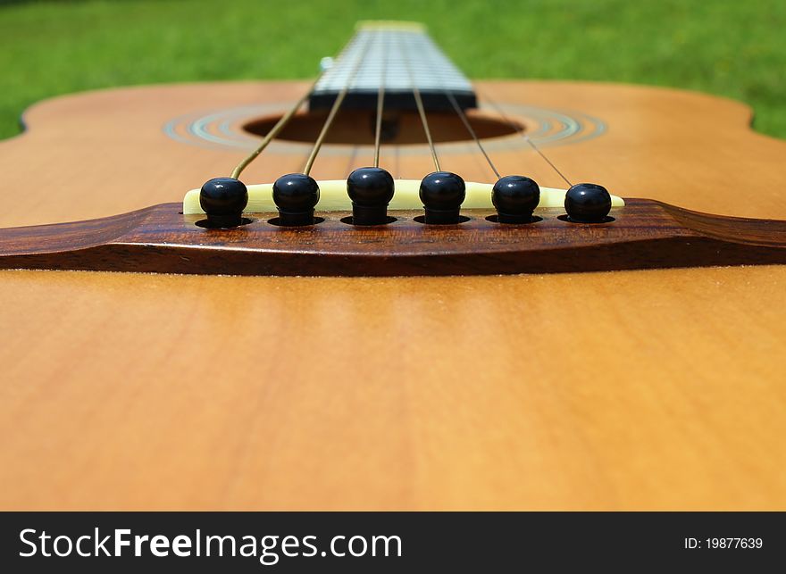 Viewing a guitar from the saddle and bridge. Viewing a guitar from the saddle and bridge.