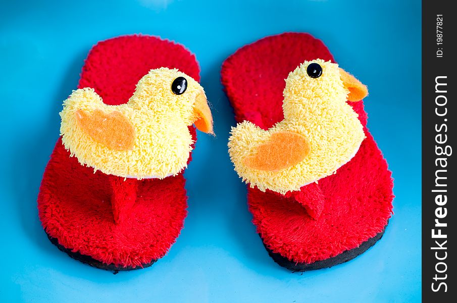 Red slipper decorate with pretty chick on the strap