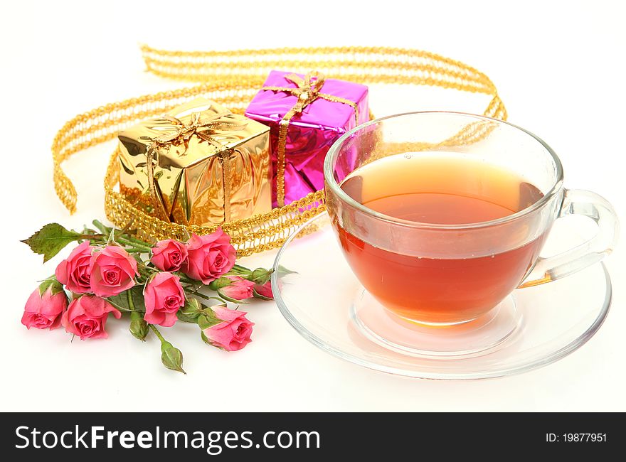 Tea and box with a gift on a white background
