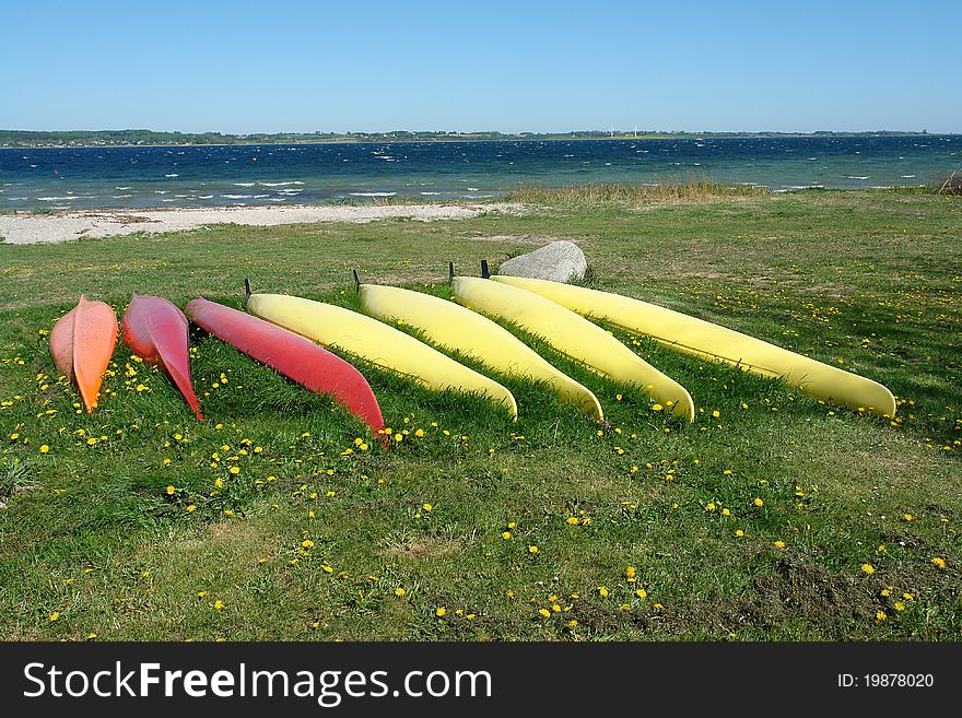 Kayaks on the beach ready for action - sea sport background image. Kayaks on the beach ready for action - sea sport background image