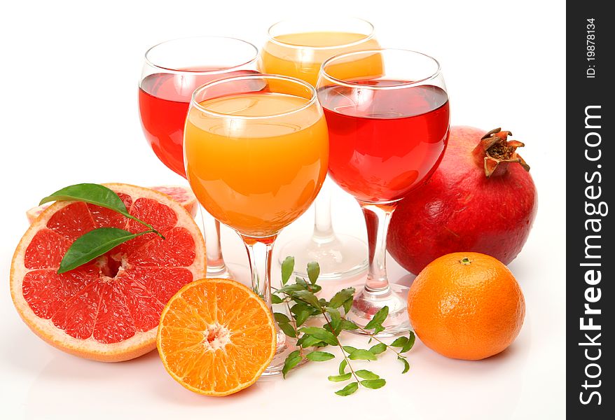 Fresh fruit and juice on a white background