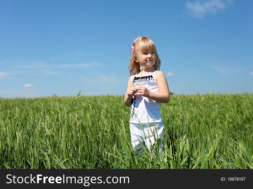 Little girl outdoors in sunny summer day