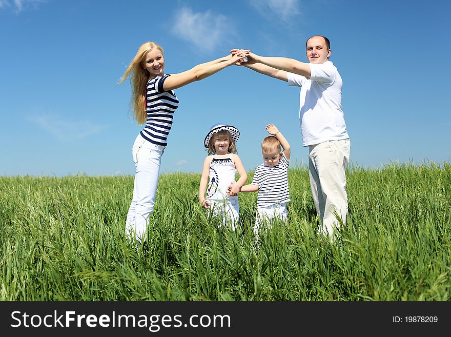 Family with children in summer day on the meadow. Family with children in summer day on the meadow