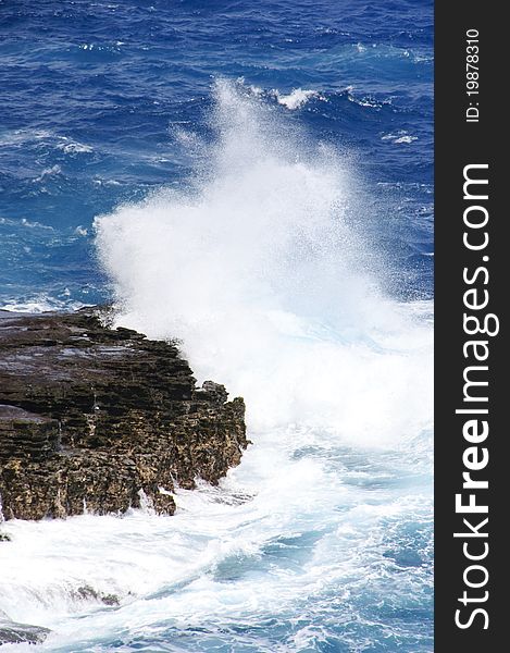 Waves splashing on lava rocks along the coast of Oahu in Hawaii. Waves splashing on lava rocks along the coast of Oahu in Hawaii.