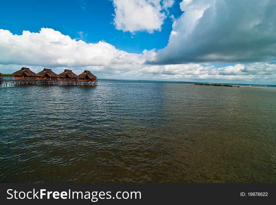 A resort of bungalows suspended on the water in the lagoon at Inhamabane, Mozambique. A resort of bungalows suspended on the water in the lagoon at Inhamabane, Mozambique