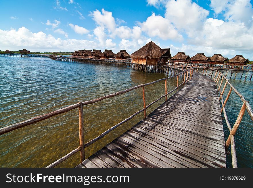 A resort of bungalows suspended on the water in the lagoon at Inhamabane, Mozambique. A resort of bungalows suspended on the water in the lagoon at Inhamabane, Mozambique