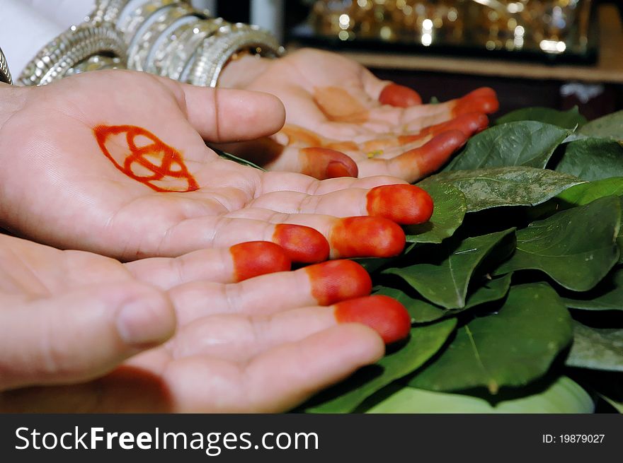An indigenous traditional Indonesian Bugis ethnic marriages where the parents and elders give blessings by way of rubbing the betel leaf and brown sugar on the palms and sprinkle rice as a sign of blessing. An indigenous traditional Indonesian Bugis ethnic marriages where the parents and elders give blessings by way of rubbing the betel leaf and brown sugar on the palms and sprinkle rice as a sign of blessing