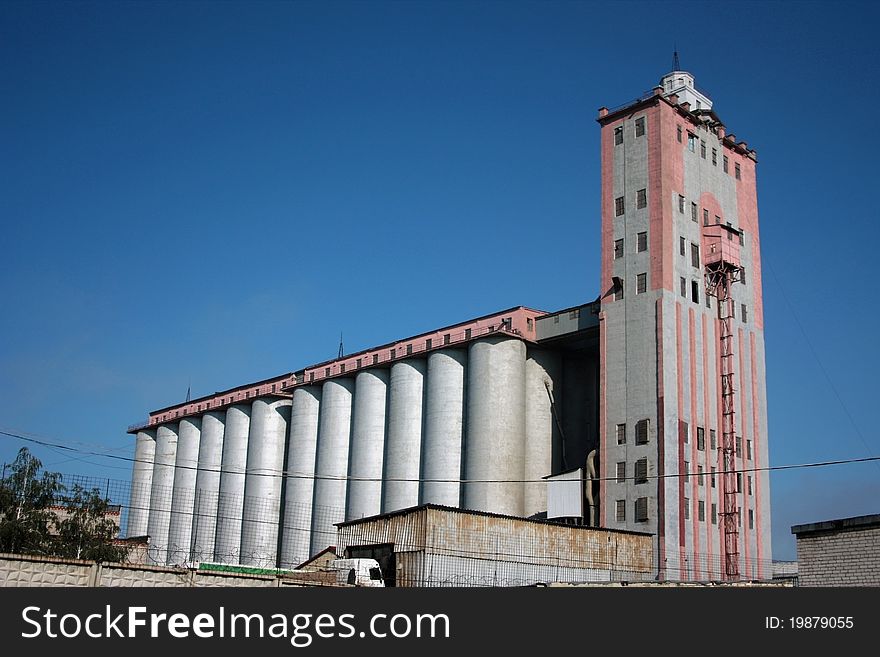 Structure of a factory on manufacture of bread on a background of the dark blue sky