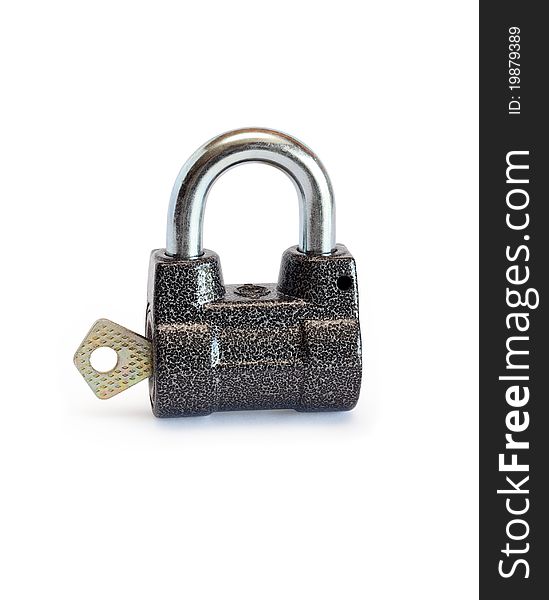 Key inserted into padlock on white background. Isolated with clipping path. Key inserted into padlock on white background. Isolated with clipping path