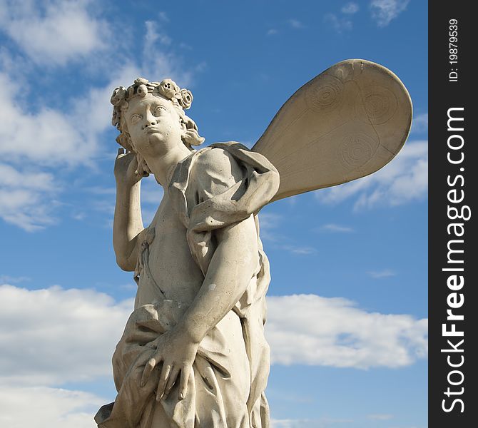 Ancient Sculpture Angel In The Blue Sky.