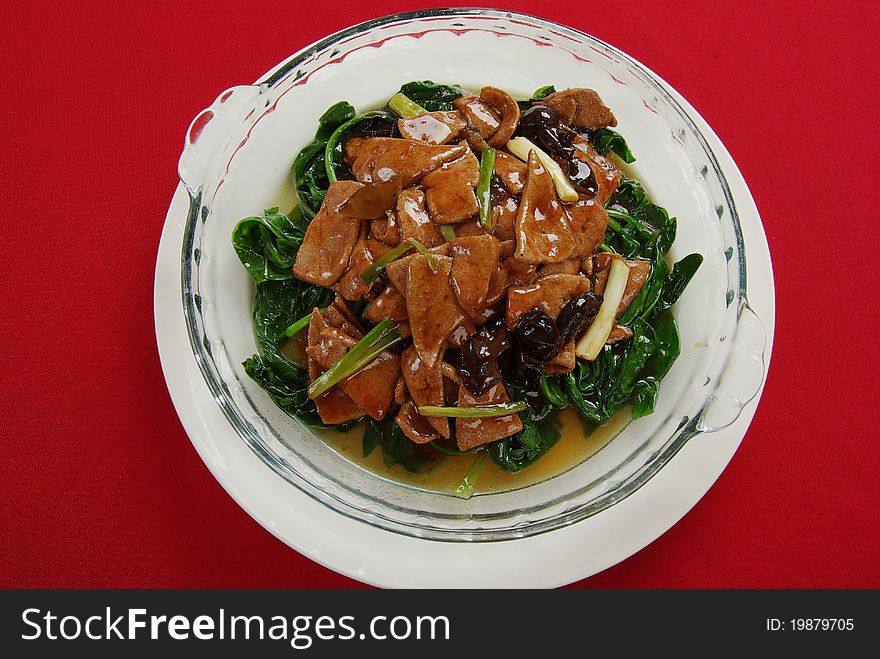 The spinach fry pig liver is very popular a China home cooking. The spinach fry pig liver is very popular a China home cooking