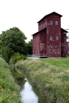 Old Granary Near A Canal. Royalty Free Stock Image
