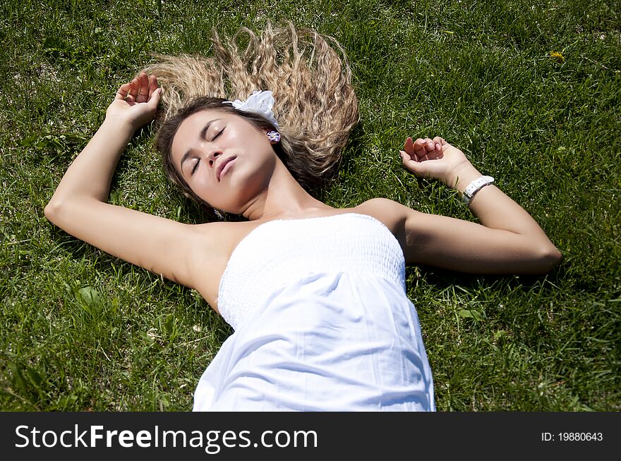 Beautiful Young Woman On Field In Summer