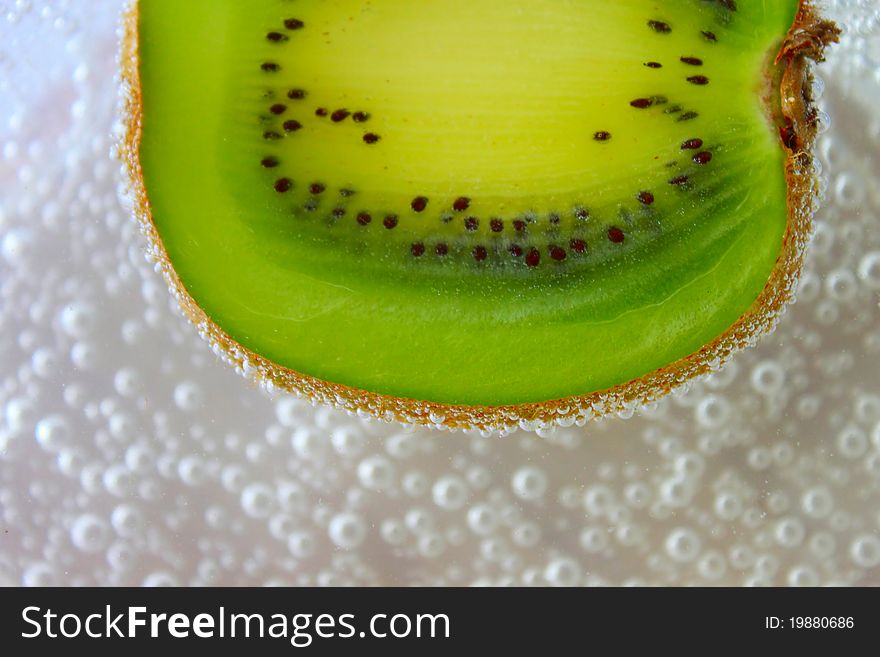 Fresh slice of kiwi in soda. Fresh slice of kiwi in soda