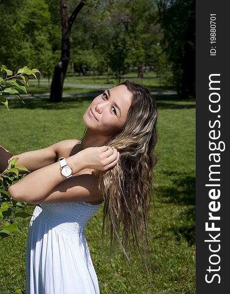 Portrait of the young woman in park. Portrait of the young woman in park