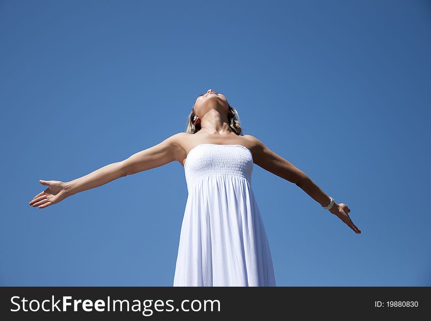 Portrait young woman having stretched hands aspires in the sky