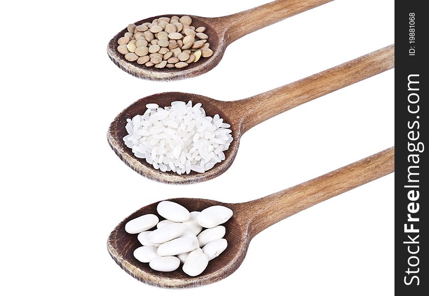 Wood Spoons With Beans, Lentils And Rice Isolated