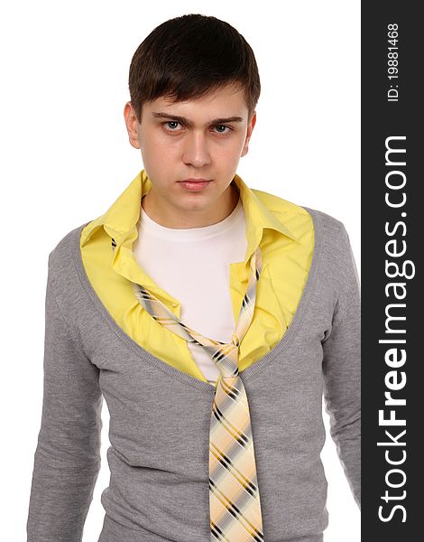 Angry young man in grey cardigan and yellow shirt with necktie. Angry young man in grey cardigan and yellow shirt with necktie.