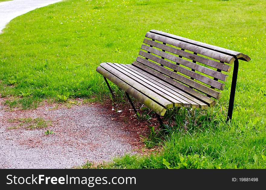 Old bench among the grass in the park. Old bench among the grass in the park