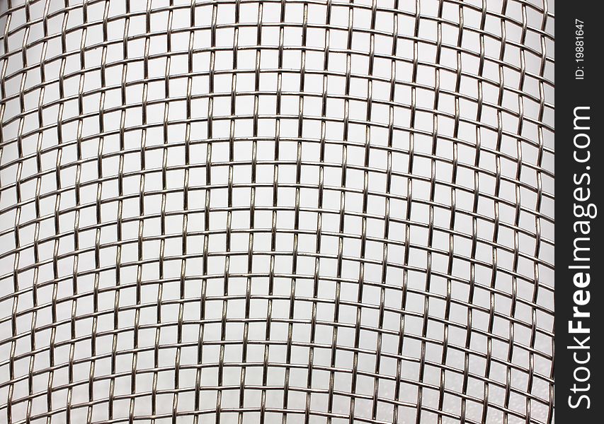 Texture of metal grid close up on white