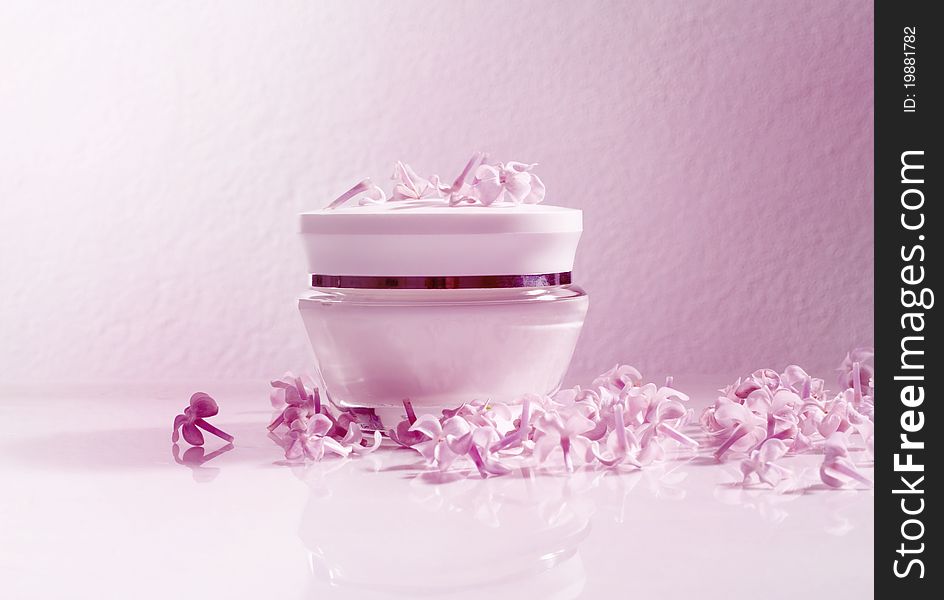 Natural cosmetics. Cream and petals of flowers.