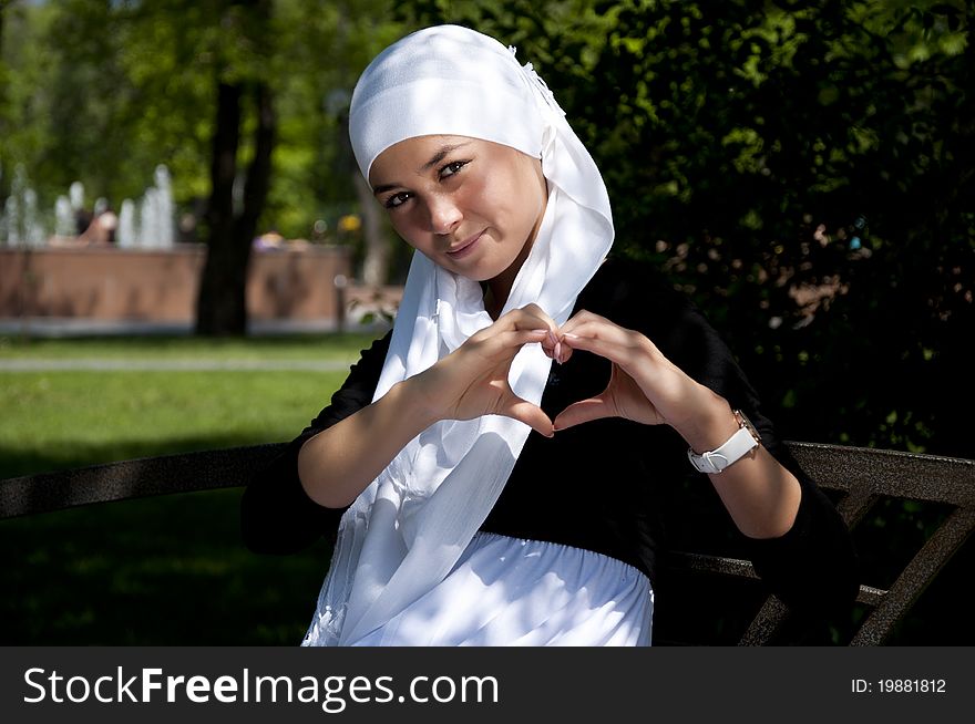 Portrait of young woman in park