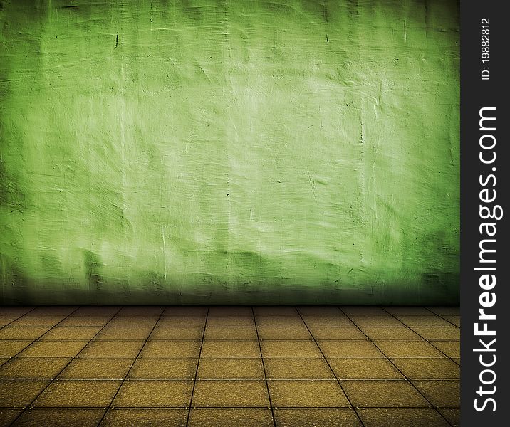 Grunge green industrial interior with tile floor with artistic shadows added and focus set on the wall. Grunge green industrial interior with tile floor with artistic shadows added and focus set on the wall