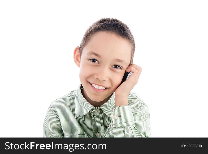 Young boy calling on the cellphone isolated on white