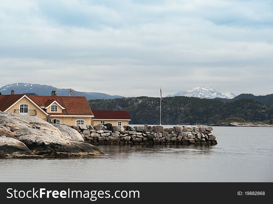 House in norwegian landscape on a cloudy day