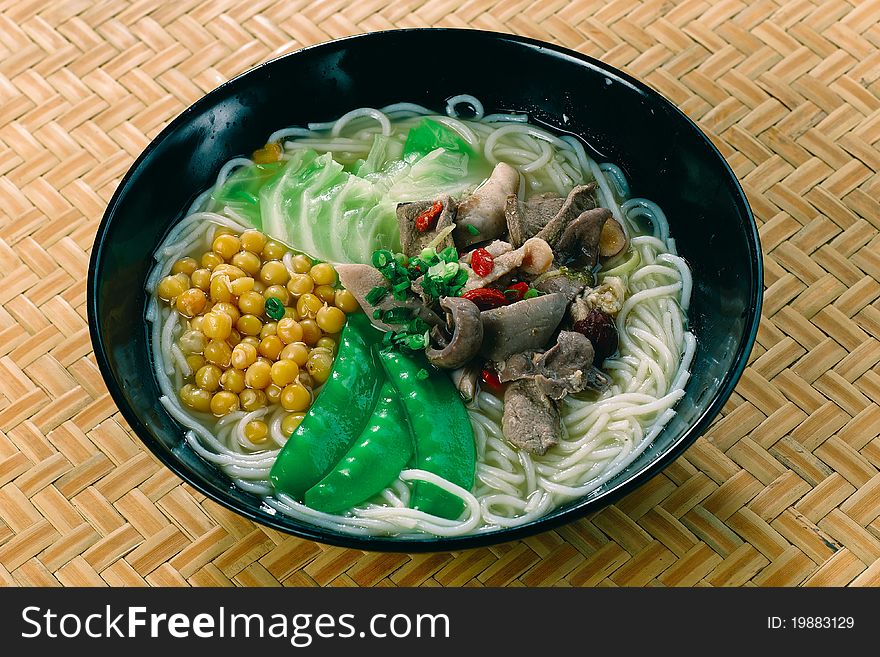 A traditional asian noodle soup with pork. A traditional asian noodle soup with pork