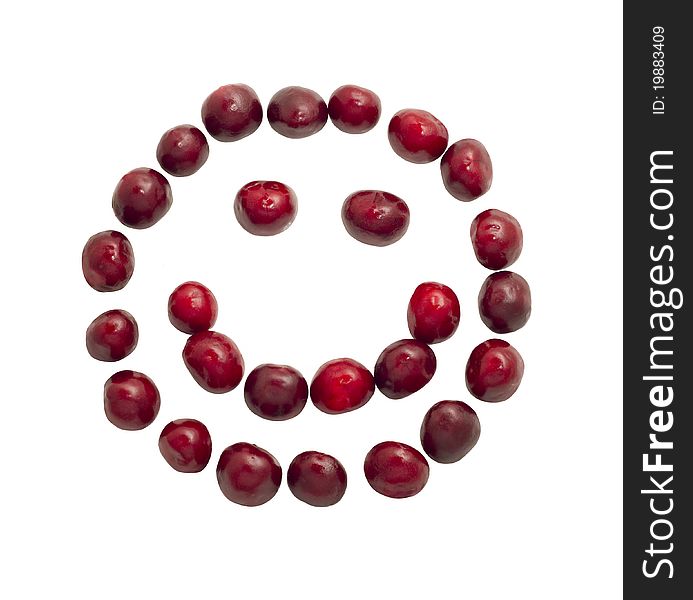 Smiling face made of cherries isolated on white background. Smiling face made of cherries isolated on white background