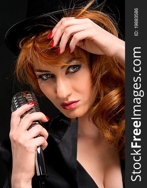 Gorgeous redhead woman with retro microphone. Gorgeous redhead woman with retro microphone