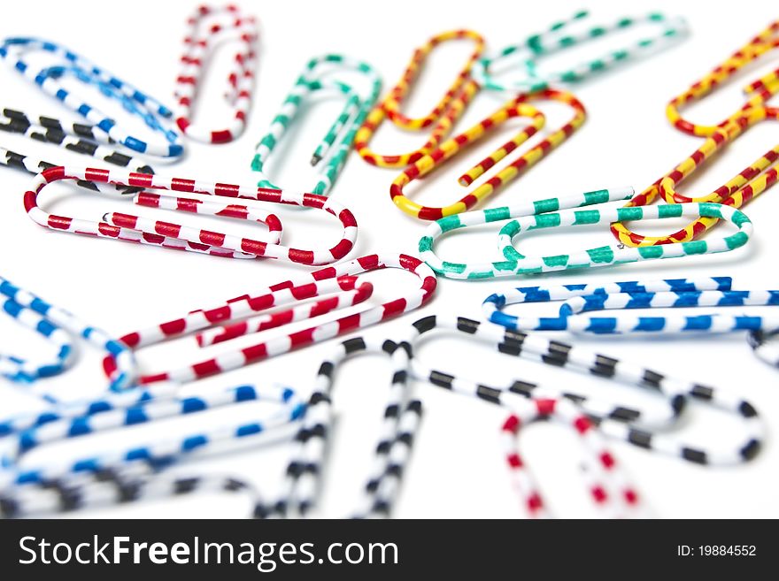 Colorful paper clips on white background