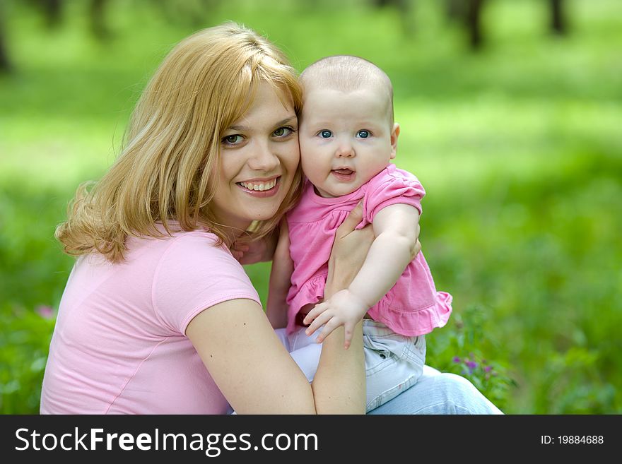 Mother and daughter in birch spring or summer park. Mother and daughter in birch spring or summer park