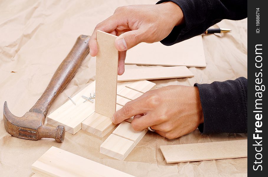 Wood Worker Building A Small Project