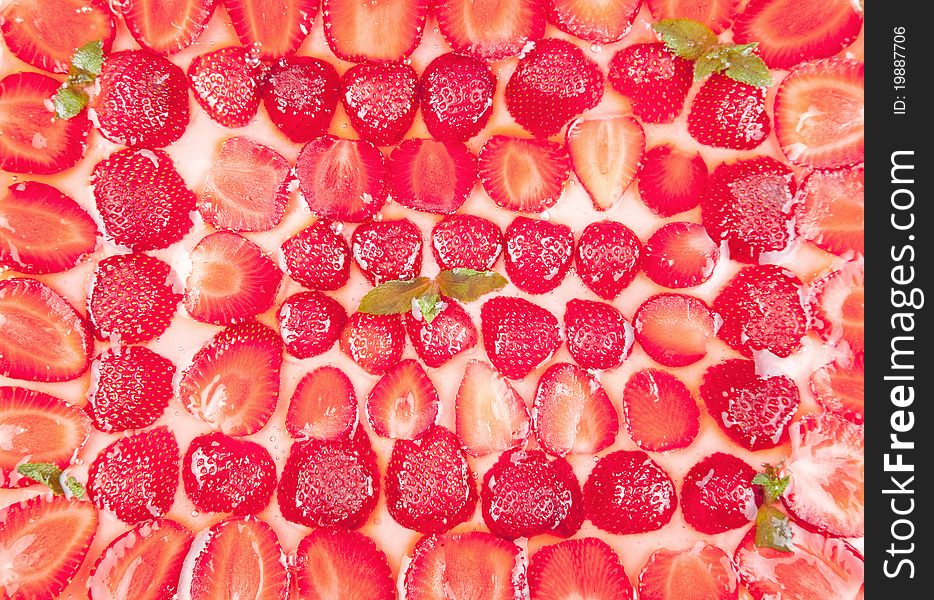 Cake with strawberries and mint on a white background