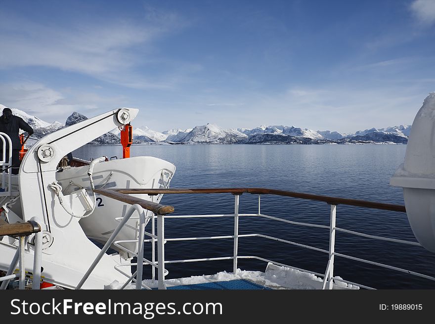 The Norwegian Coastline with mountains in the background, from the deck of a cruise ship