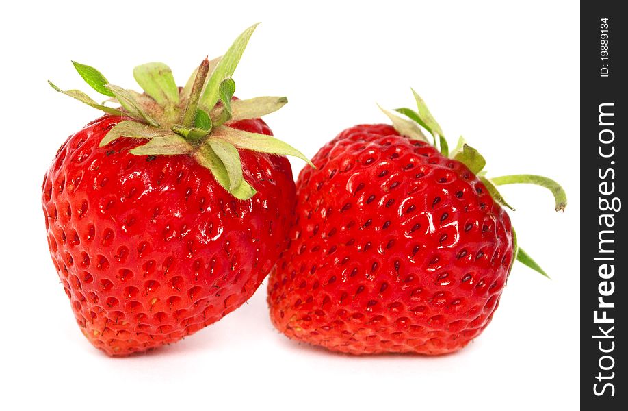 Two ripe strawberries on the white background