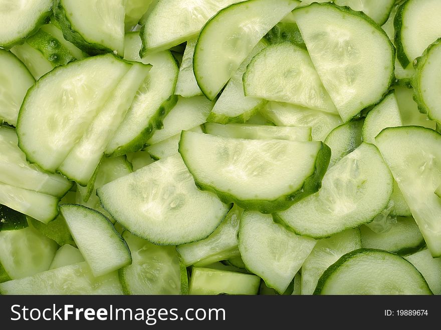 Closeup sliced green cucumber background. Closeup sliced green cucumber background