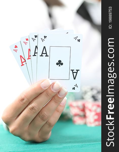 Female hand hold the four aces isolated in studio. Female hand hold the four aces isolated in studio